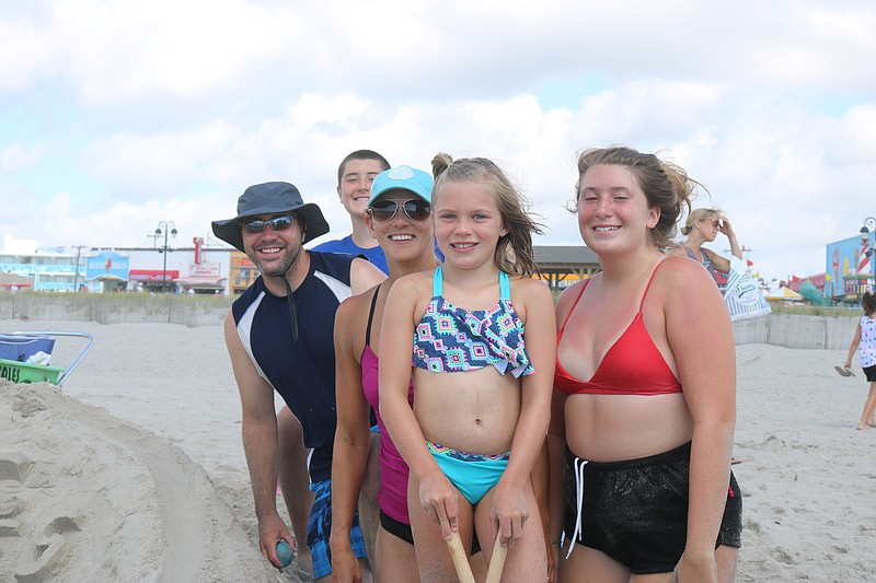 Phil and Marti Mazurowski with their daughter Ellie and cousins, Megan and Billy Anderson, by "OC Races."