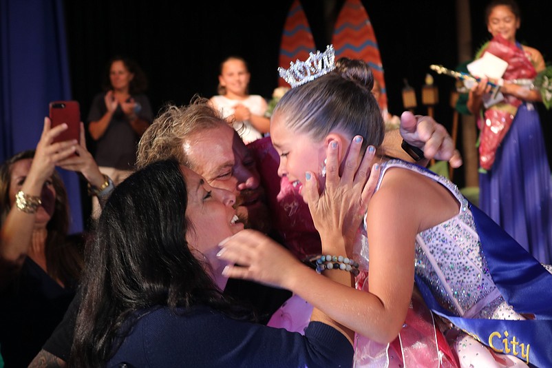 Little Miss Ocean City 2019 Stevie Wright gets hugs from parents Stacie and Brian Wright.