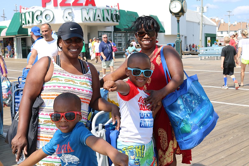 Takisha Jones and her sons EJ, 7, and Tyrone, 4, of Ridleytown, P.a., and Takisha's sister, Annette Ford, of Delaware, get ready for the beach and Boardwalk.