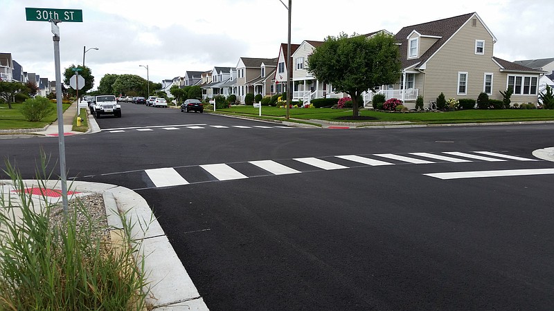 After being ripped up for months for drainage work, the roads have been repaved between 28th and 34th streets.