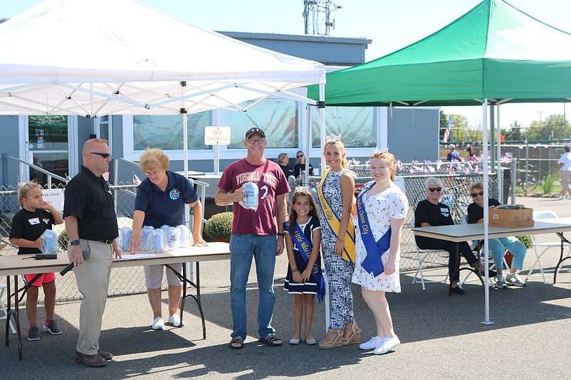 Best of Show aircraft winner Dave Shuster, center, is joined by Ocean City Municipal Airport manager Todd Dwyer, Little Miss Ocean City Stevie Wright, Miss Ocean City Megan Keenan and Miss Junior Ocean City Julia Wilson.