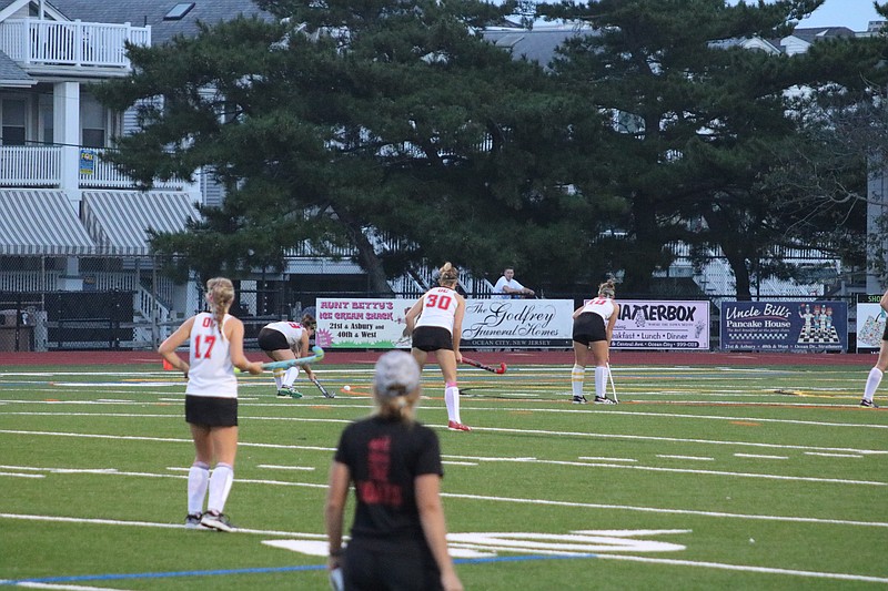 Ocean City players Meredith Moon (17) and Morgan Decosta (30) get ready for a penalty corner.