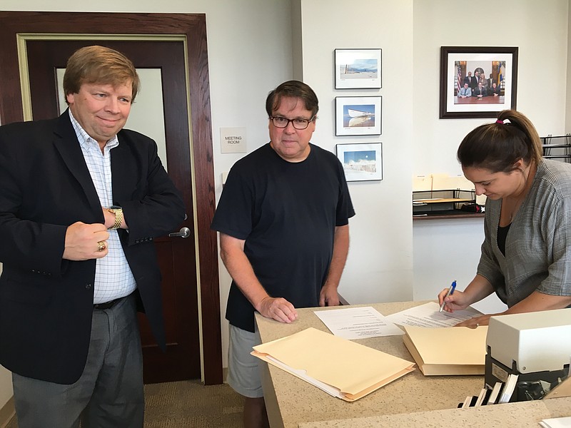 Fairness In Taxes President Dave Hayes, left, and Vice President Dave Breeden hand in the petition to Ocean City Clerk Melissa Rasner on Tuesday. (Courtesy Dave Hayes)