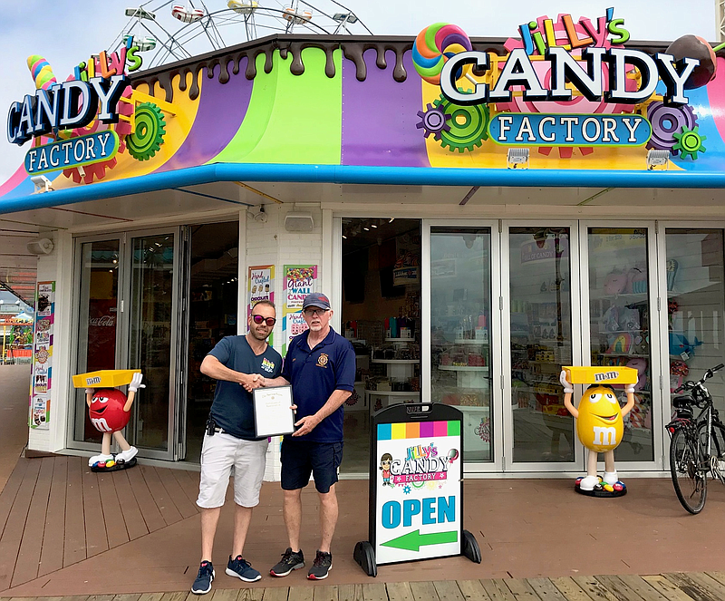 Jody Levchuk (left), owner of Jilly’s Candy Factory, says he is very civic minded. In 2018 he received a commendation from the American Legion Post 524 from post member Jerry Bonner. (Photo provided by Doug Otto)