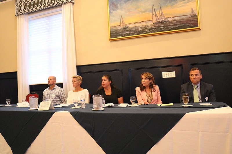 Panelists Frank Donato, Patty Talese, Shawda McGinnis, Michele Gillian and David Allegretto, listens as Ken Wisnefski details the expanded app.