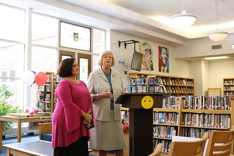 Amy Andersen's eyes welled up with tears as Schools Superintendent Kathleen Taylor speaks about the American Sign Language teacher's dedication to her students.