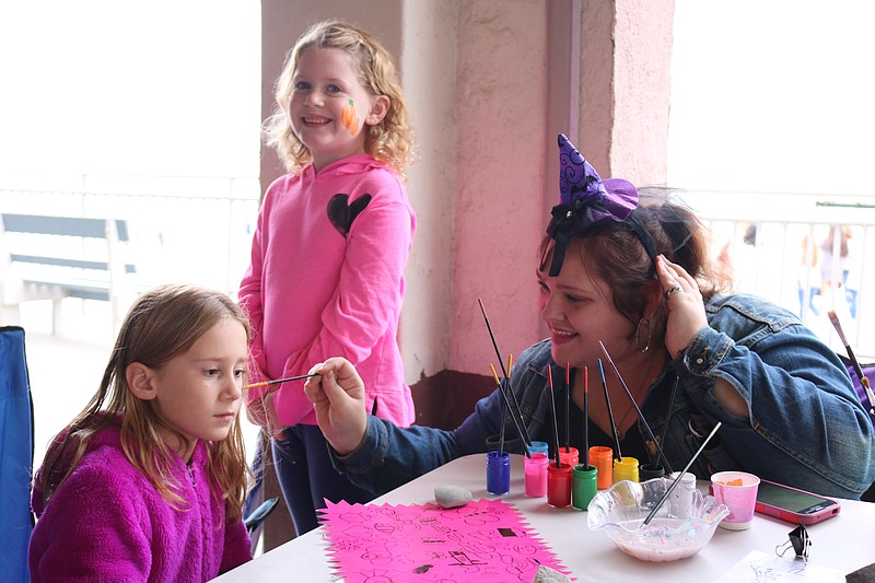 In addition to chili and chowder, kids had their faces painted. Ocean City 7-year-old twins, Cailyn and Lindsay Dunn, get their faces painted by Taylor Lanick.