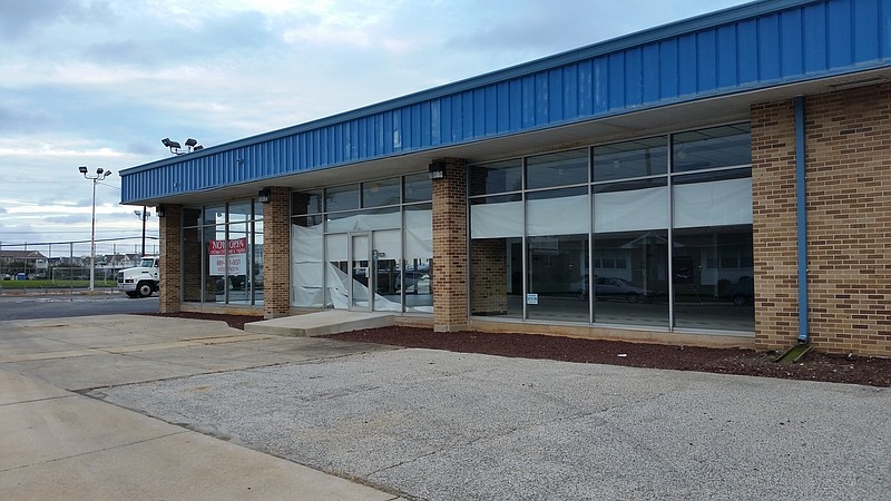 The former Perry-Egan auto dealership showroom, shown here in 2018, was demolished to clear the site at 16th Street and Haven Avenue.