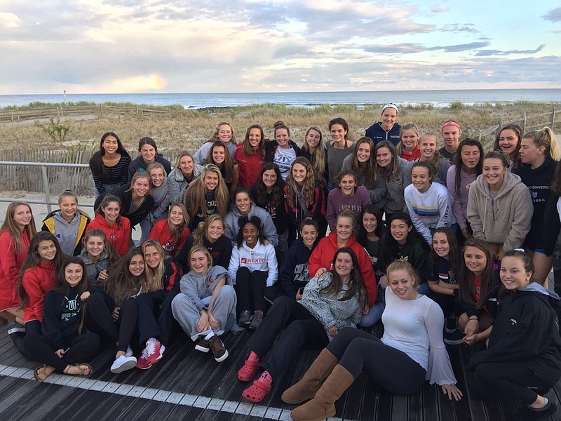 Ocean City's hockey team poses for a group photo on the Boardwalk while having a celebratory dinner Monday evening hosted by Brown's Restaurant. (Courtesy Maureen Schneider)