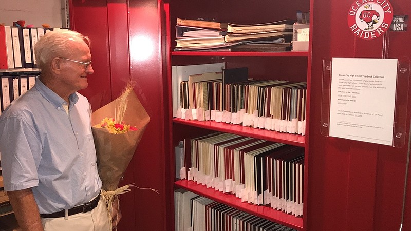 Charlie Bowman, a member of the Class of '57, checks out the yearbook case his class donated to the Ocean City Historical Museum.
