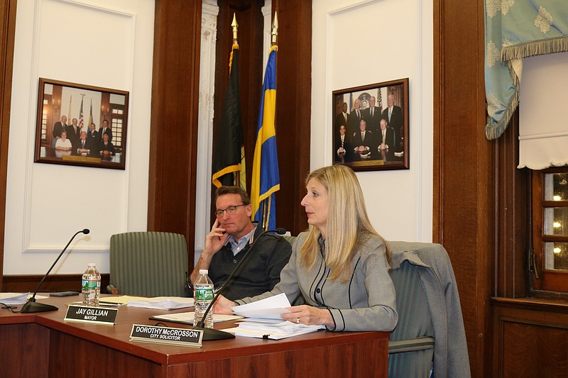 City Solicitor Dorothy McCrosson, seated next to Mayor Jay Gillian, explains the affordable housing plan to Council.