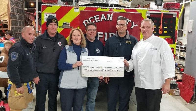 The Chili Chowder Festival at the Music Pier raises thousands of dollars for charitable causes. From left, Firefighters Kevin Muller and Bob Bender, Jane Davis of Johnny B Goode Ice Cream Parlor, Fire Chief Jim Smith, Firefighter Jason Boyle and Bill McGinnity of Cousin’s Restaurant. (Courtesy Ocean City Restaurant Association)