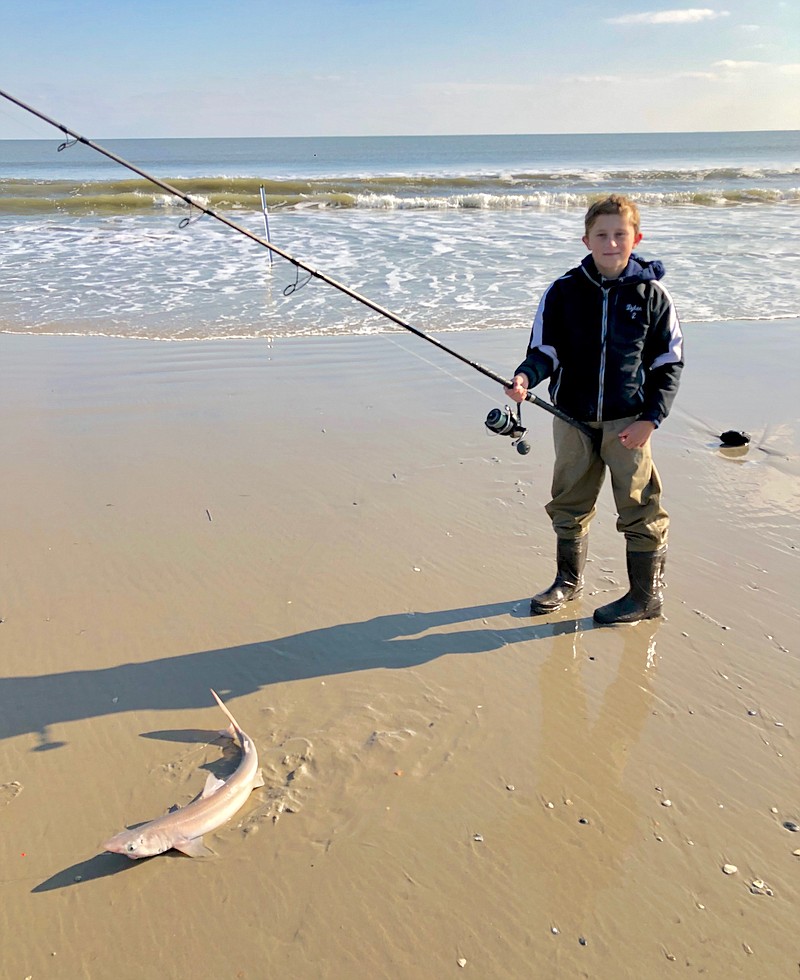 Dylan O'Connell,11, of Merchantville, shows off a dogfish that helped him win a trophy.