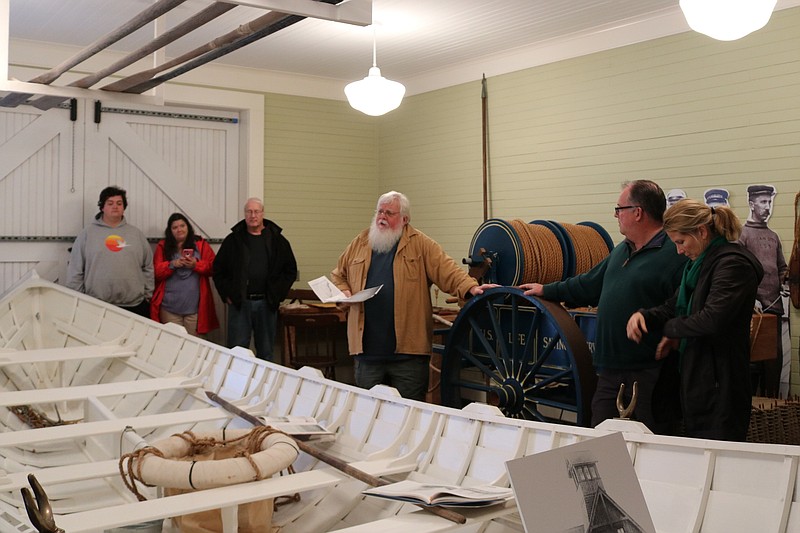 Historian John Loeper tells a crowd in December at the U.S. Life Saving Station that there is much to be learned about the Sindia. 