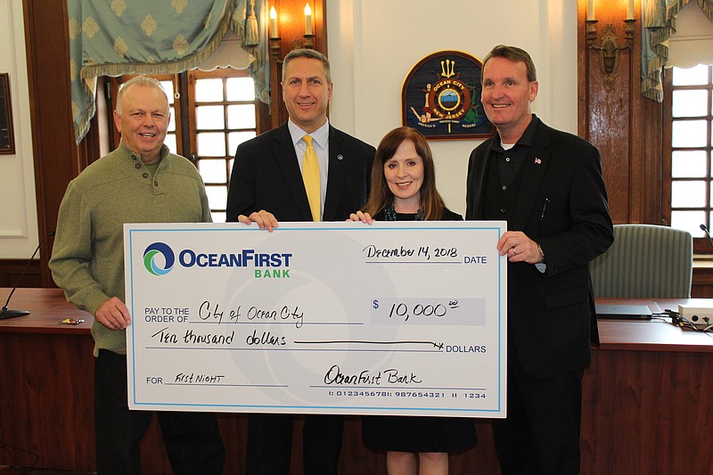 From left, OceanFirst Bank's Vice Chairman Steve Brady, Southern Region President Vincent D’Alessandro and Vice President of Digital Strategy and Innovation Tricia Ciliberto present a $10,000 donation to Mayor Jay Gillian to support Ocean City’s 2019 First Night celebration.