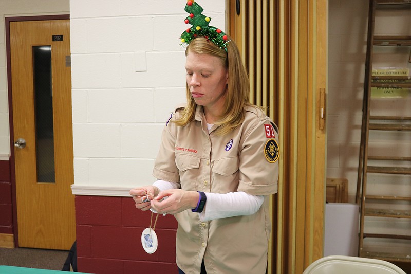 "The Christmas season isn’t about receiving, it is about giving," Cub Scouts Master Katie Grim says.