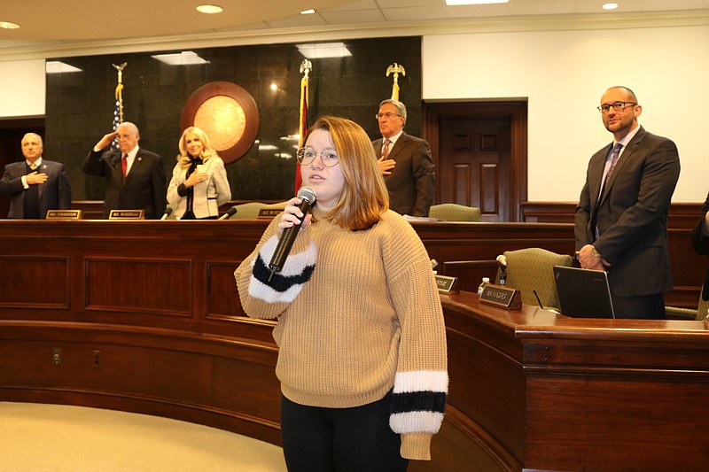 Junior Miss Ocean City Julia Wilson, 16, sings the National Anthem at the ceremony.