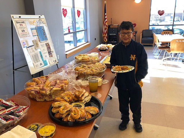 Rob Malmitano, 12, enjoys lunch after cleaning up the area around the Ocean City Intermediate School, which he attends.