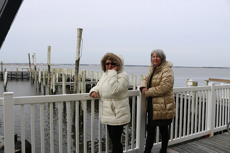 Susan Kwiatkowski, left and Susan Yeck, who both own condos and boat slips at the Harbor House, are anxious for the dredging work to be completed.