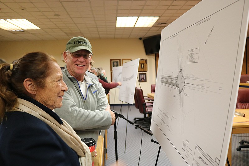 Patty Dorr-Lewin and John Szramiak discuss the area in the proposed bike path route along Mays Landing Road.