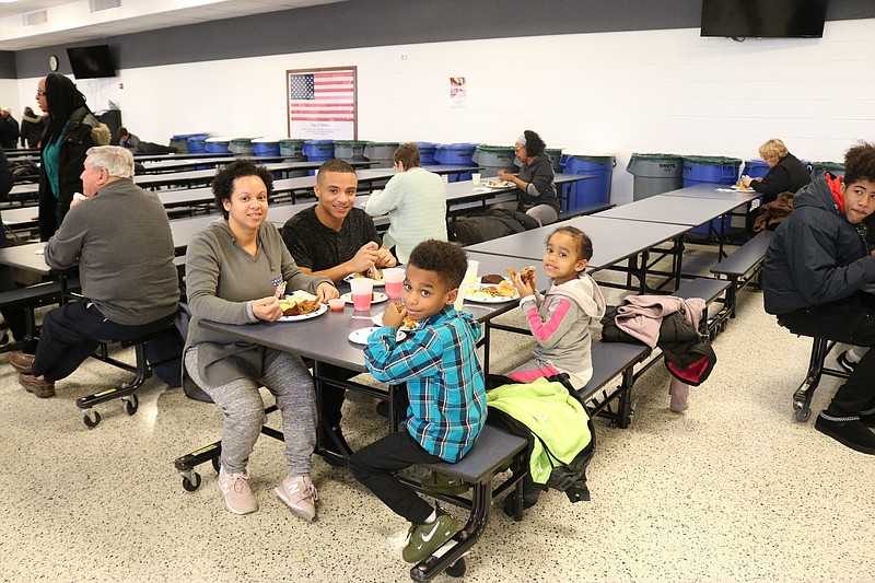 The Ackley family enjoy soul food after the Martin Luther King Jr. celebration at the Ocean City High School.