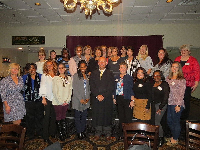 CASA volunteers pose with officials for a group photo. (Courtesy CASA)