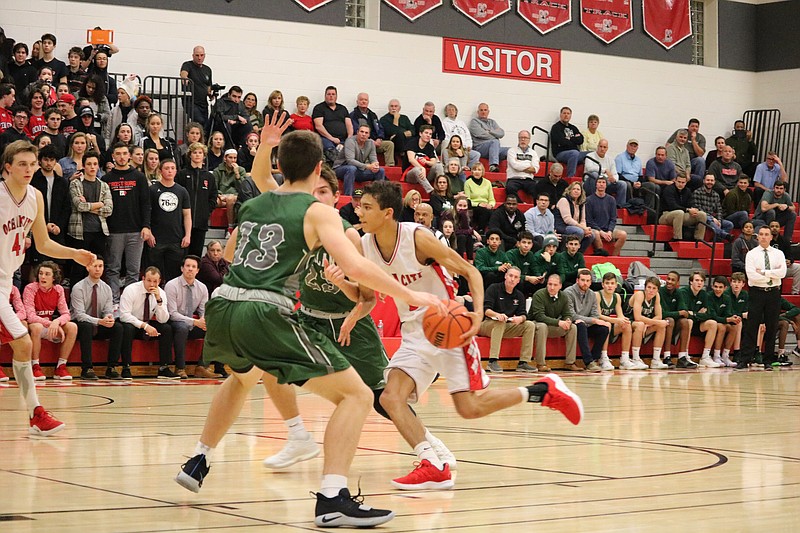 Donovan Graham (5) drives to the basket.