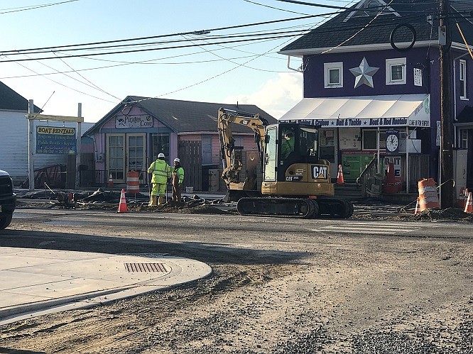 A crew is pictured working at 3rd & Bay.