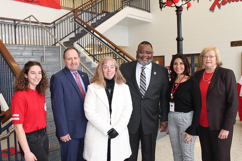 Board of Education members and student representative pose for a photo.