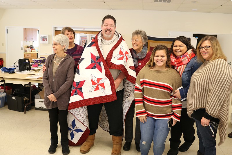 Air Force veteran John Watson, of  North Cape May, is moved when he receives a Quilt of Valor from the South Jersey Quilts of Valor Foundation at the Seaville Fire House while accompanied by his family and foundation members. 