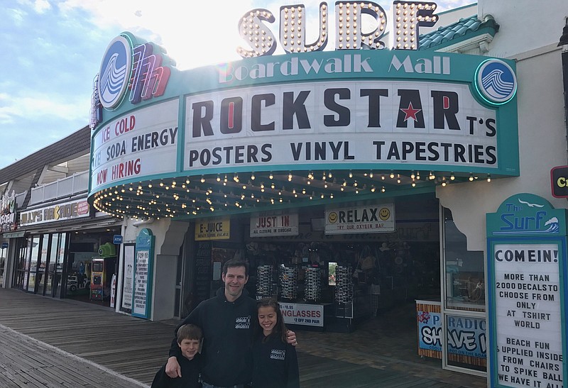 President of the Boardwalk Merchants Association Wes Kazmarck with his children, Liam and Piper outside of Surf Mall. (Courtesy Wes Kazmarck)