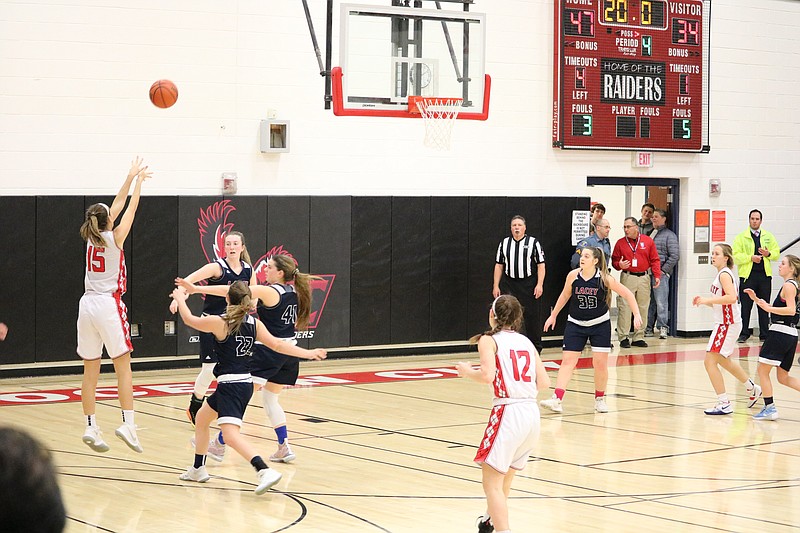 Ocean City's Stephanie Carey shoots a three-pointer from the corner.