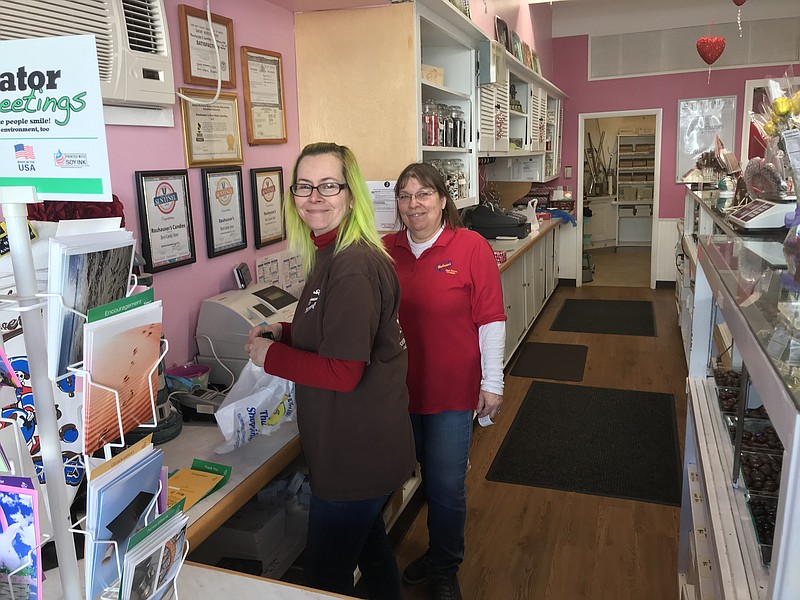 Debbie Lombardozzi, left, and Tina Mituzas were busy all day at Rauhauser’s Candy.