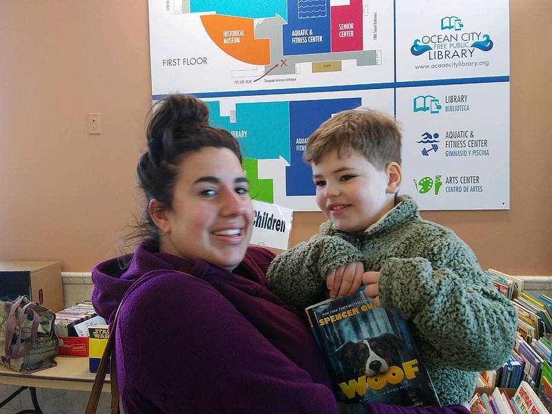 Toni Gheen, of Ocean City, and her son, Charlie, 4, make a morning of it at the book sale at the Ocean City Free Public Library.