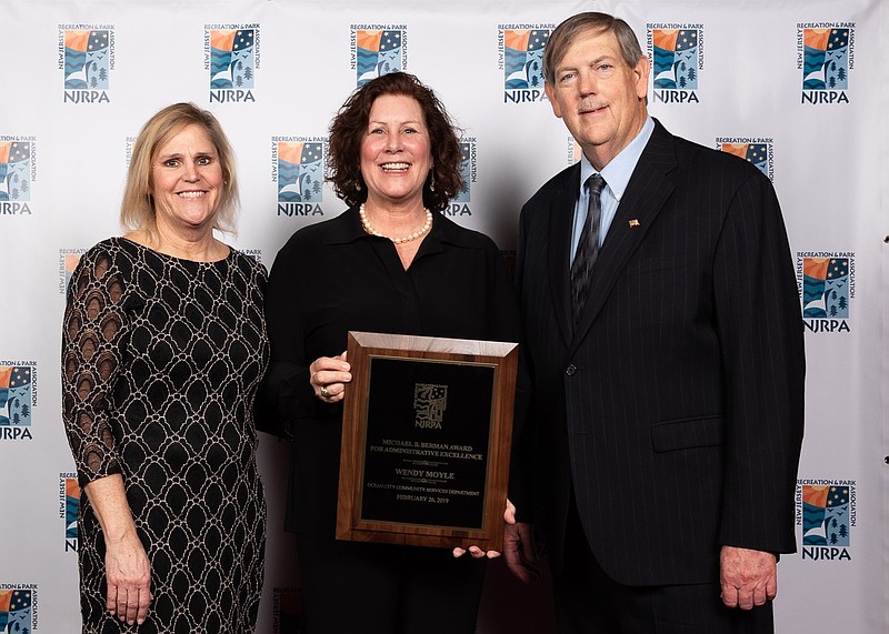 Wendy Moyle, center, receives the Michael B. Berman award at the ceremony in February. (Courtesy New Jersey Recreation and Park Association)