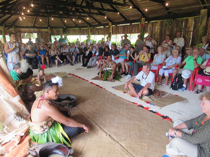 The audience of cruise ship passengers is captivated by a Tonga welcoming ceremony in New Zealand.