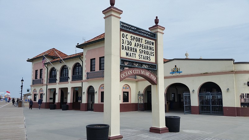 The sign out front advertises the Sports Memorabilia Show at the Music Pier on Saturday.