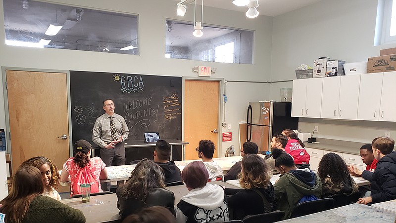 Students listen to business owner Mike Seidel talk about tattooing during a workshop. (Photo courtesy Cape May County Tourism)