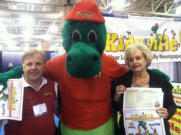 Cool Kind Kid creator Barbara Gilmour with Bill Bowman, president and publisher of Kidsville News, and the publication’s mascot "Truman the Dragon" at the N.J. Education Association Convention in Atlantic City. (Photos courtesy of Barbara Gilmour)