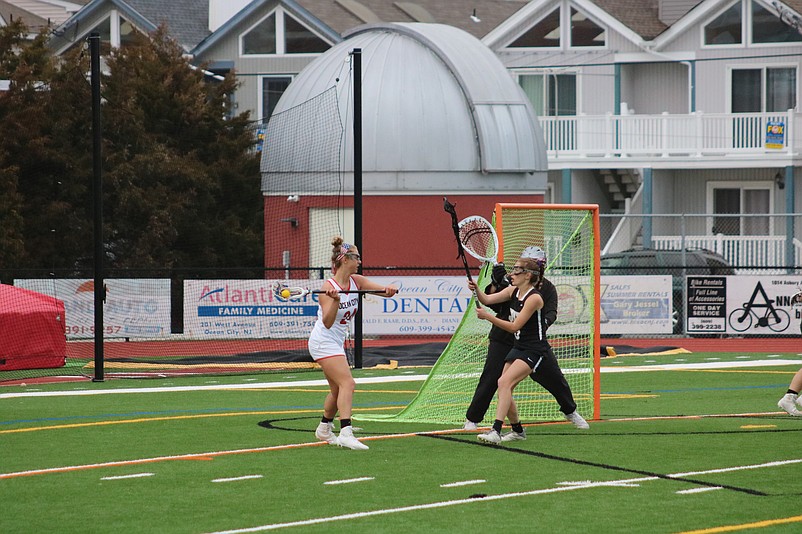 Ocean City's Emily DiMarino looks to feed a teammate near the net.