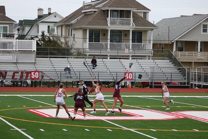 Ocean City's Danielle Donoghue dominates on the draw with a one-handed grab. 