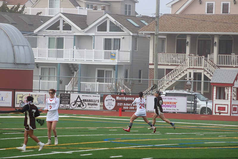 Ocean City's Shannon Decosta hawks the ball on defense.