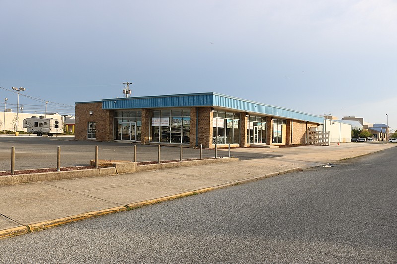 The land surrounding an old Chevrolet car dealership building is being eyed by the city.