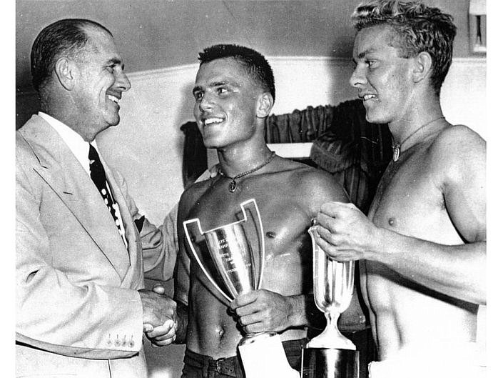 Olympic Gold Medalist John B. Kelly (left), presents the hardware to his son Jack (center) and Joe Regan, OCBP teammates who took the Doubles Row title at the 1944 South Jersey Championships.  The younger Kelly, whose younger sister Grace won an Academy Award and became Princess of Monaco would go on to win a singles crown at the Henley Regatta. (Photo credit pinterest.com)