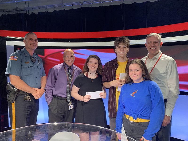 From left, Lt. Brian Hopely, Media Teacher Greg Wheeldon, students Kayla Killian, Nathan Goudie and Anna McCabe and Bike OCNJ Chairman Tom Heist of Heist Insurance. 