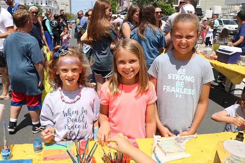 Upper Township friends, Mackenzie Jenkins, 7, and Darrah Ostrander, 7, with her sister, Marley, 10, try their hand at painting.