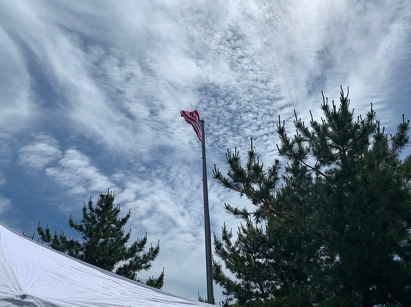 The flag flies majestically in the breeze.