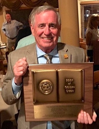 Jack Hagan displays his plaque.