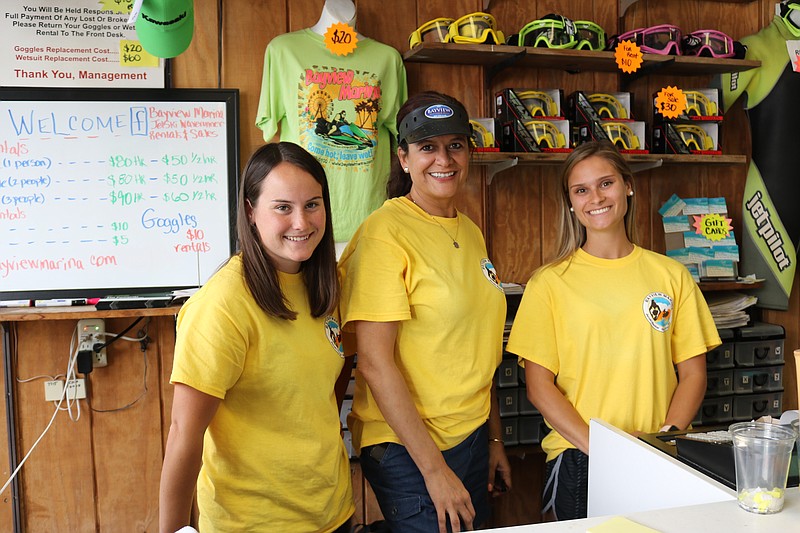 Maira Middleton, co-owner of Bayview Marina, middle, with employees Glory Johnson, of Syracuse, N.Y., and Danielle LaPergola, of Mays Landing.