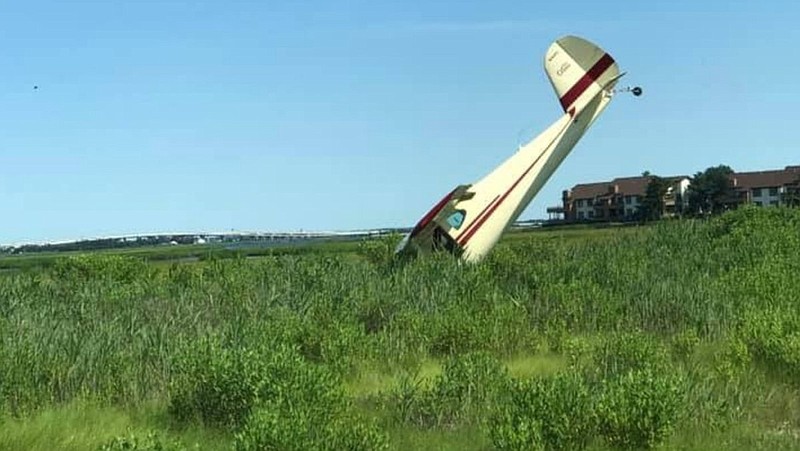 A small plane crashes Sunday in the marshlands near Ocean City Municipal Airport. No one was injured, police said. (Courtesy Ocean City Firefighters Association Facebook page)